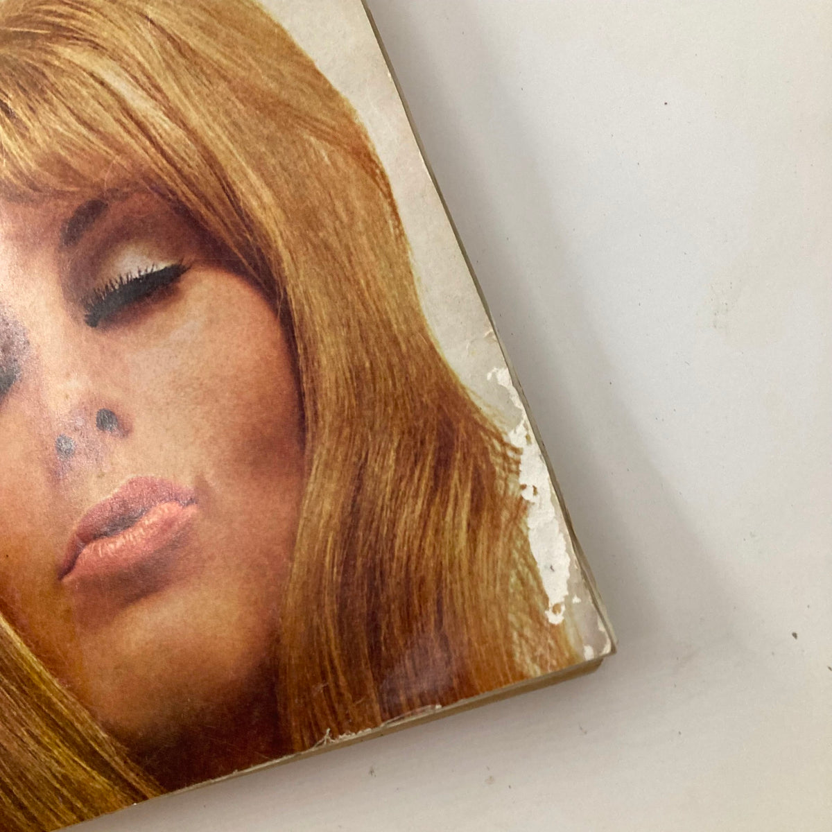 Close-up view of the December 1969 Playboy magazine cover featuring Playmate Gloria Root, showcasing her iconic look with long blonde hair and sultry expression.
