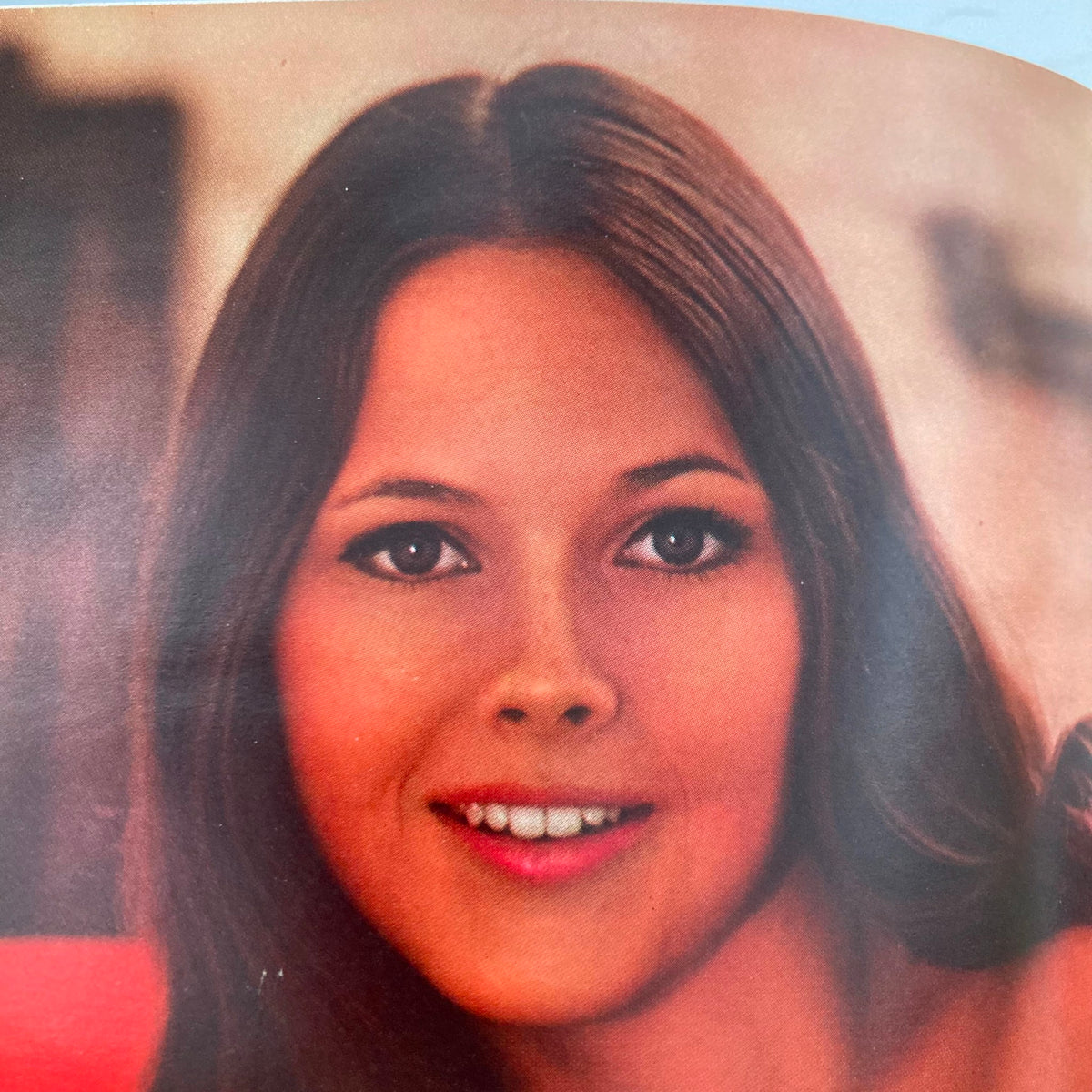 Portrait of Playmate Gloria Root from the December 1969 Playboy magazine, highlighted by her captivating smile and expressive eyes, representing 1960s beauty.