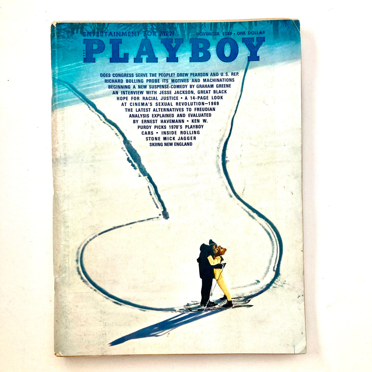 VTG Playboy Magazine November 1969 cover featuring an iconic image of a couple skiing, representing the cultural essence of the late 1960s.