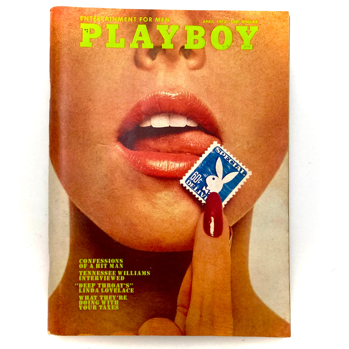 Vintage Playboy Magazine April 1973 cover featuring Playmate Julie Woodson with a striking photograph and a playful stamp.