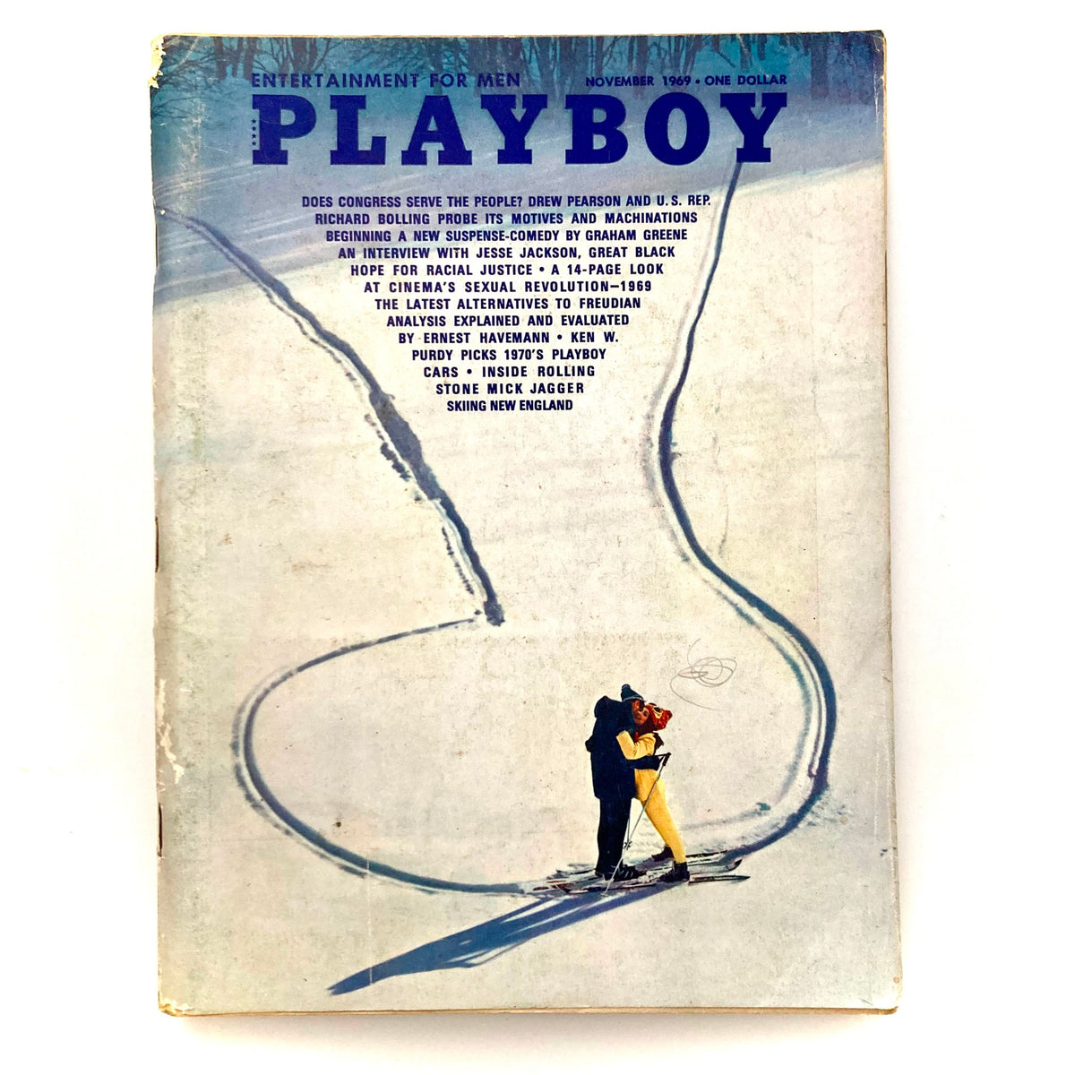 Cover of Playboy Magazine November 1969 featuring a couple on snowy terrain, highlighting the vintage allure of the issue.