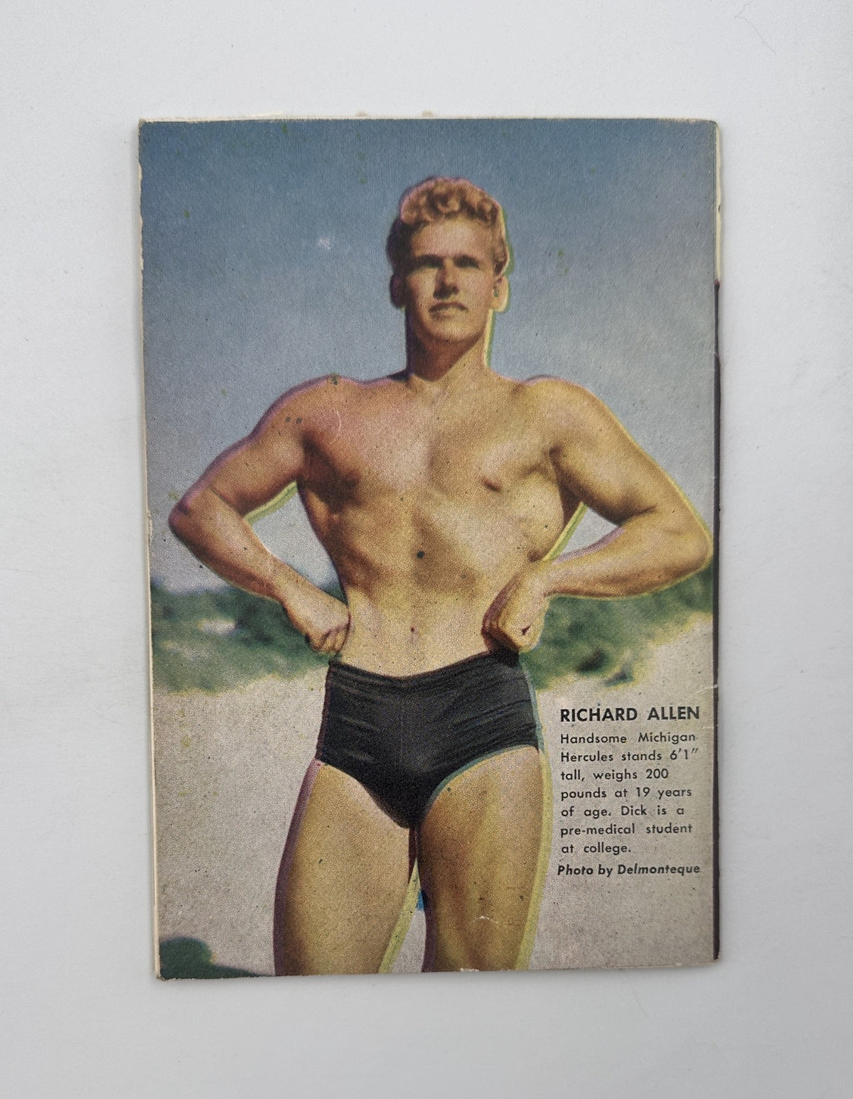 ADONIS bodybuilding muscle beefcake PREMIERE ISSUE #1 interior page showcasing Richard Allen, a muscular model, with a background emphasizing his physique, promoting the mid-century fitness aesthetic.