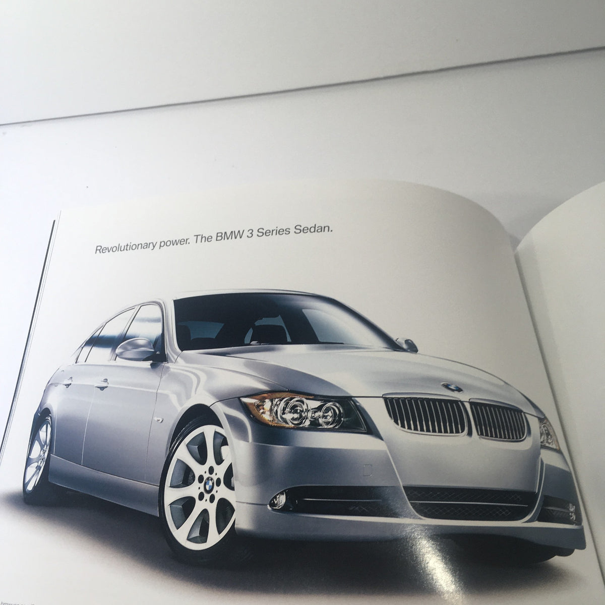 2007 BMW Full Line BMW 3 Series Sedan Dealership Car Auto Brochure Catalog showcasing a silver BMW 3 Series Sedan with a sleek design and revolutionary power.