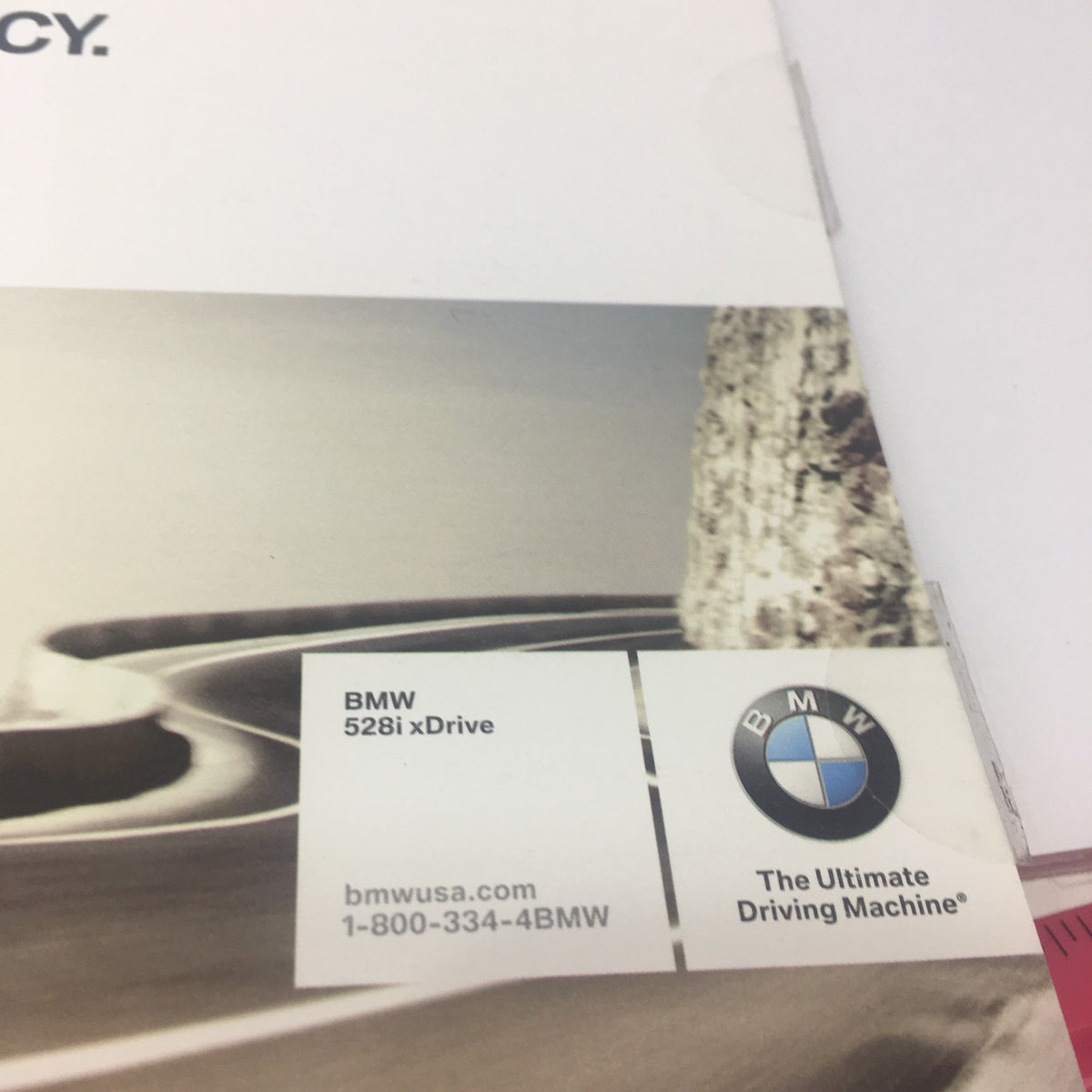 Logo and contact information from the 2009 BMW 528i xDrive Dealership Car Auto Brochure Catalog.