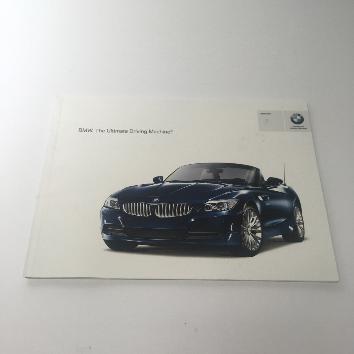 2009 BMW Full Line Dealership Car Auto Brochure Catalog featuring a blue BMW sports car on the cover. Ideal for car enthusiasts and collectors.