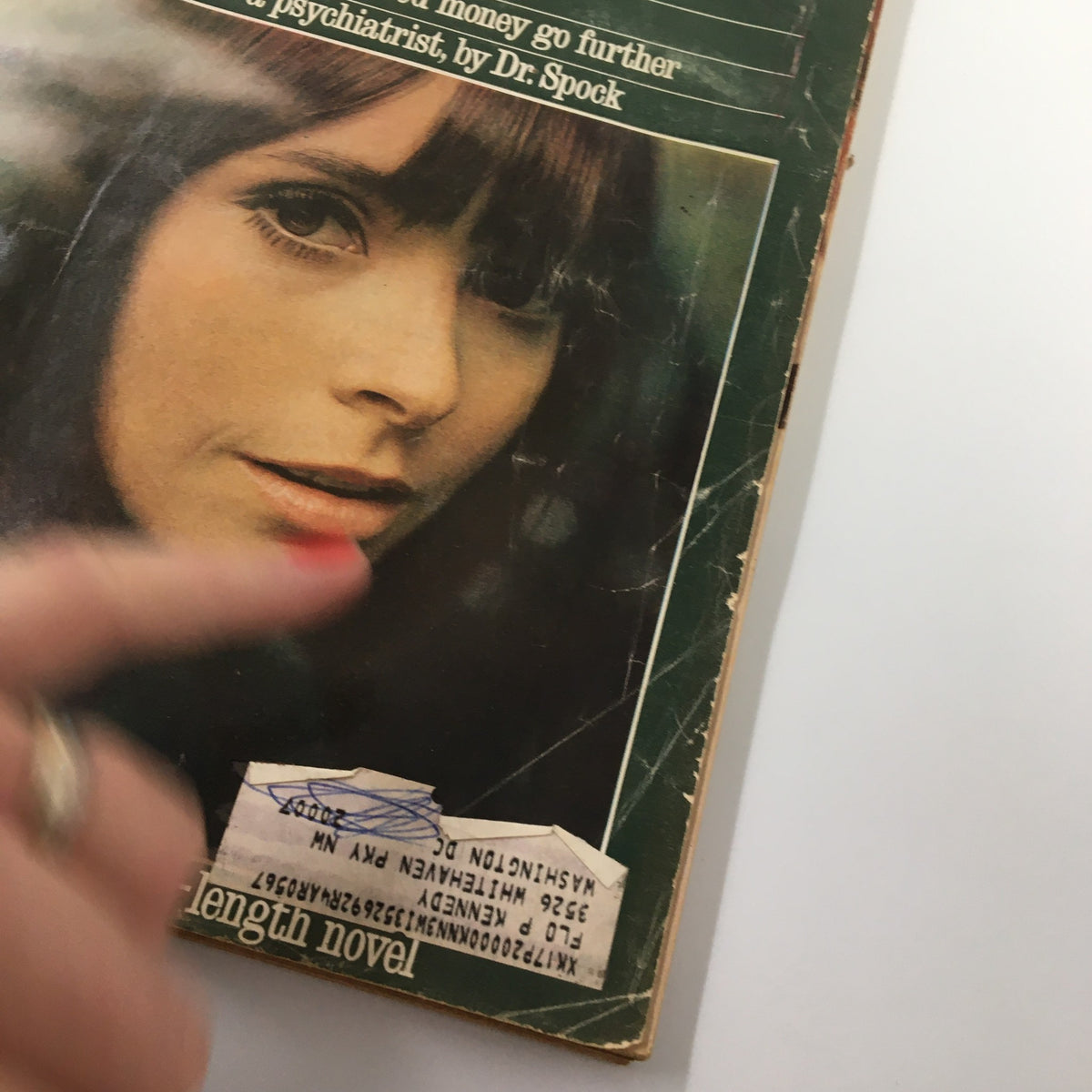 Close-up view of the cover of VTG Redbook Magazine May 1966 showcasing the woman's face and price tag, with text discussing articles on relationships.