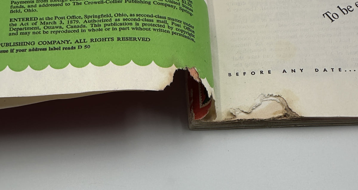 Damage detail of Woman’s Home Companion Magazine December 1950 Christmas Cover Holiday Issue, showing torn edge and wear on the binding.