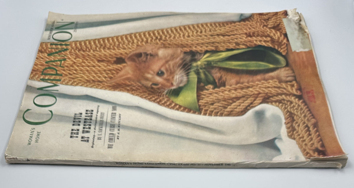 Woman’s Home Companion Magazine November 1946 with a cat on the cover partially hidden in a knitted fabric, highlights 'The Devil at Westease' by V. Sackville-West.