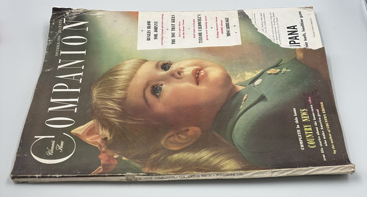 Alternate view of the cover of Woman’s Home Companion Magazine from November 1950, displaying the title prominently with a close-up of a young girl, alongside articles like 'The Toy That Kills' and 'Bugles Blow for Johnny'.
