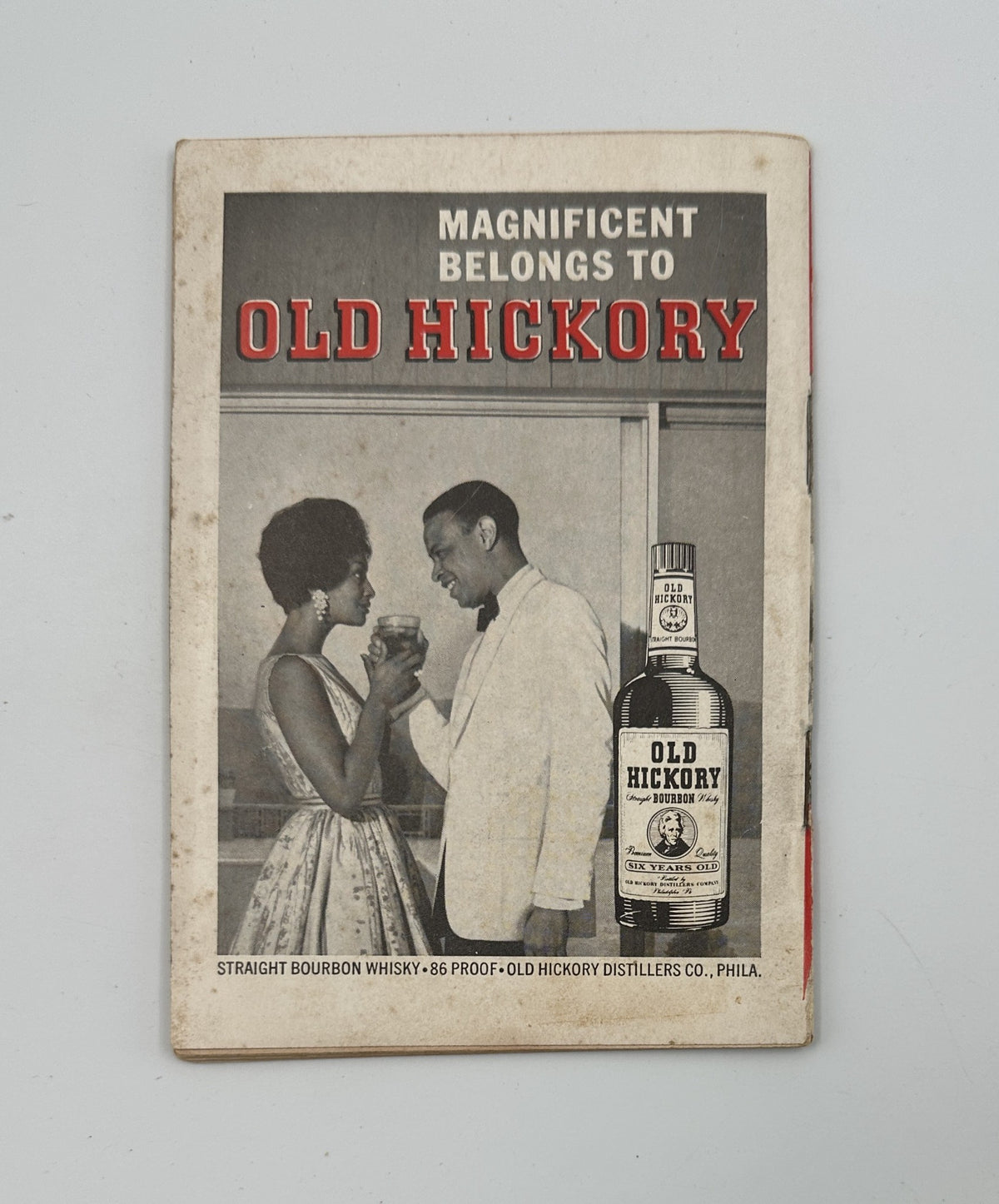 Advertisement page in Jet Magazine May 24, 1962 for Old Hickory Bourbon Whisky, featuring a stylish couple enjoying a drink at an elegant gathering.