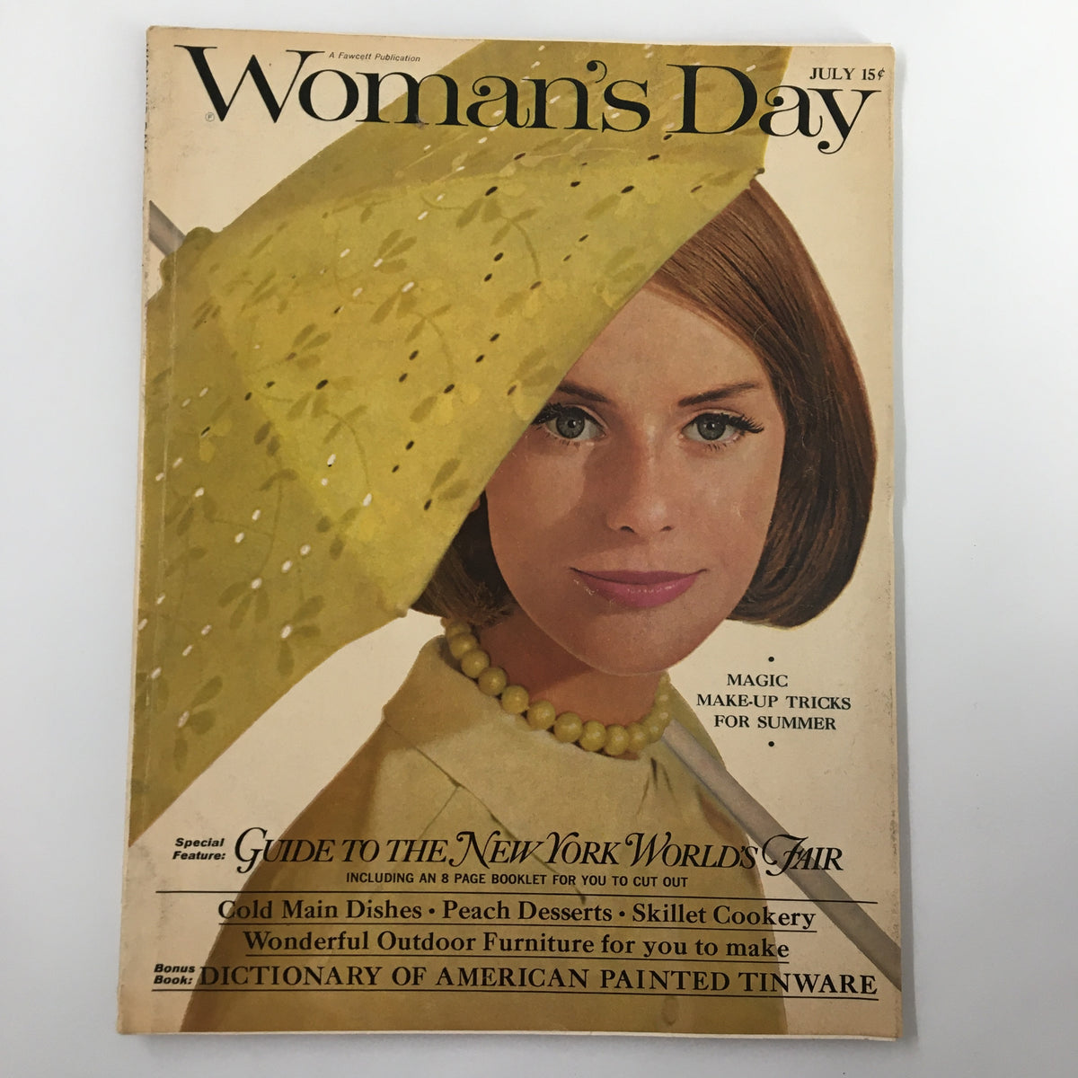 Cover of VTG Woman's Day Magazine July 1964 Guide to New York World's Fair featuring a woman with a yellow umbrella, showcasing vibrant colors and vintage design.