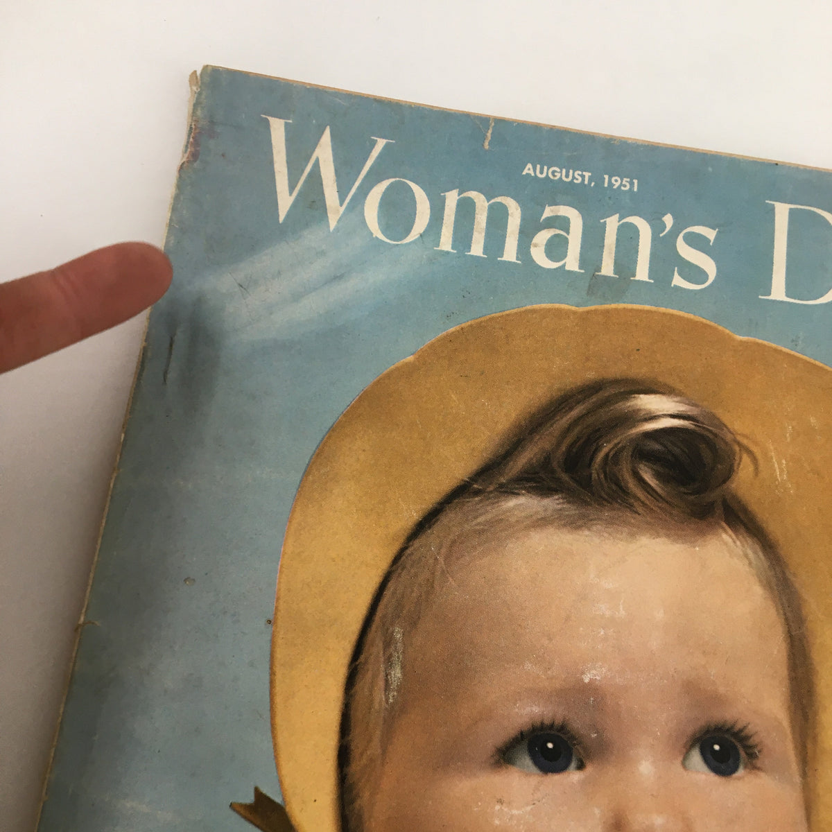 Cover of VTG Woman's Day Magazine August 1951 featuring a child with a worried expression during a day at the beach.