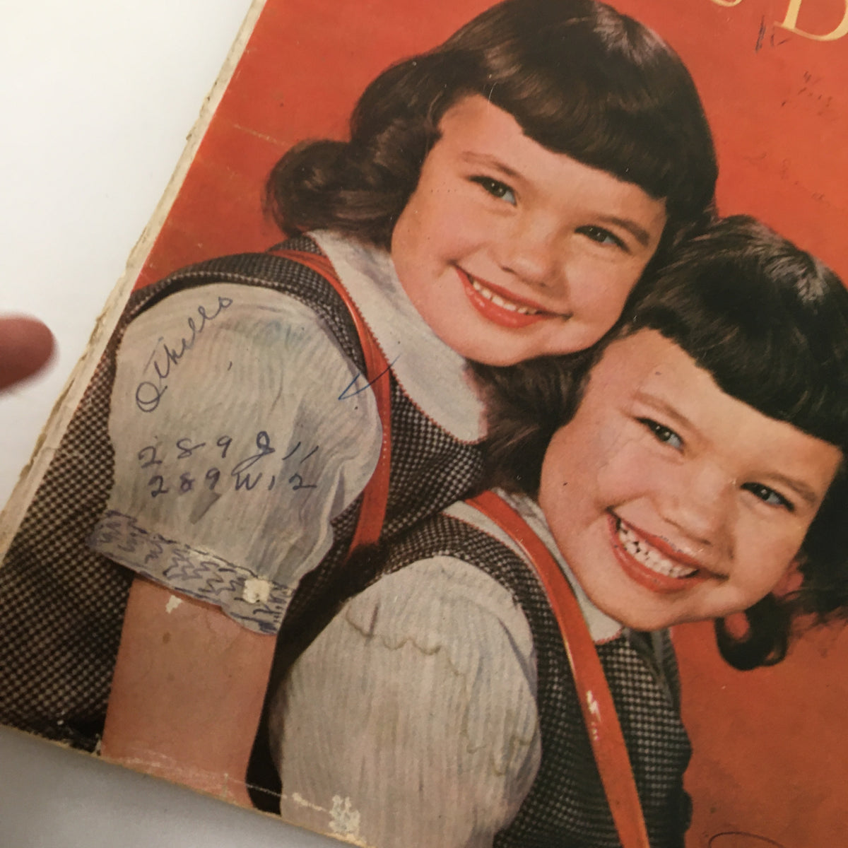 Close-up of the cover of VTG Woman's Day Magazine October 1948 highlighting two girls with hair and outfits representative of the 1940s.