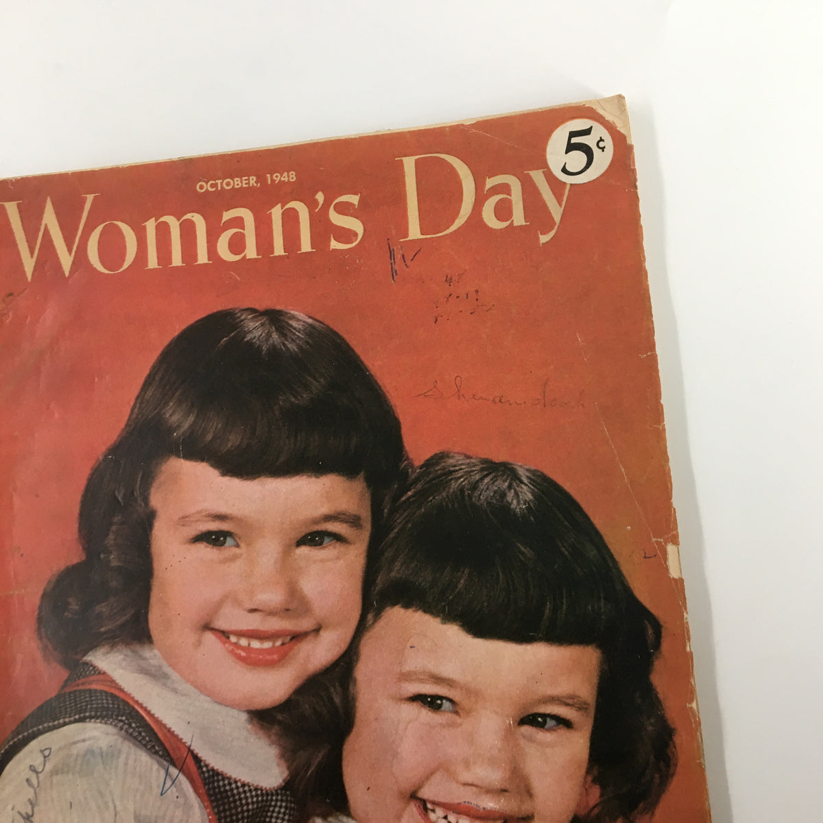 Another view of the cover of VTG Woman's Day Magazine October 1948, capturing the vintage aesthetic and two girls smiling.