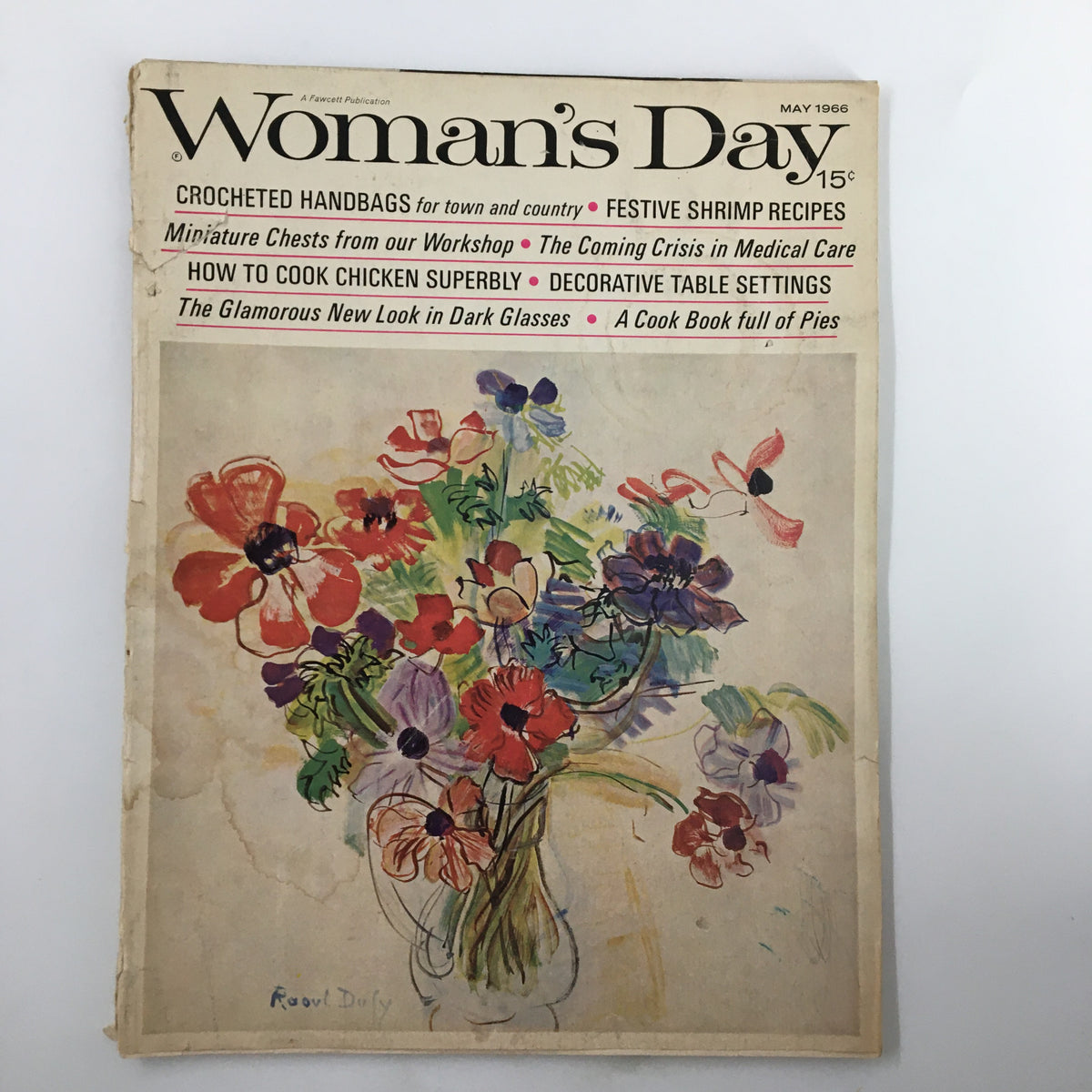 Cover of VTG Woman's Day Magazine May 1966 featuring a colorful floral illustration and the title, 'The Glamorous Look in Dark Glasses.'