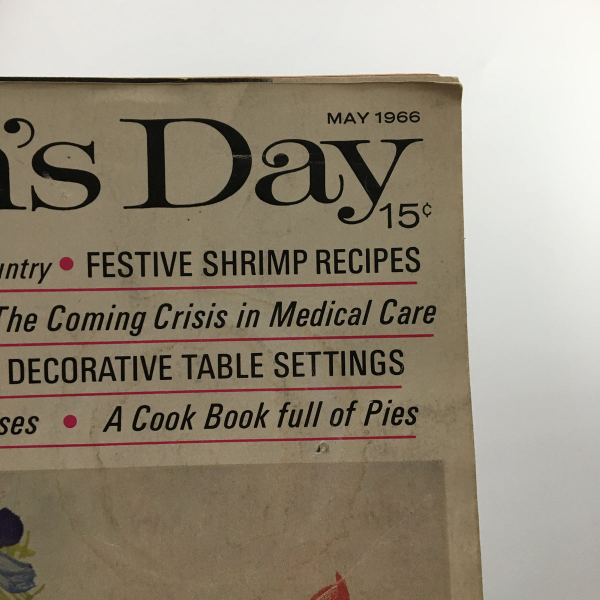 Upper section of VTG Woman's Day Magazine May 1966 displaying magazine title and featured articles including 'Festive Shrimp Recipes' and 'Decorative Table Settings.'