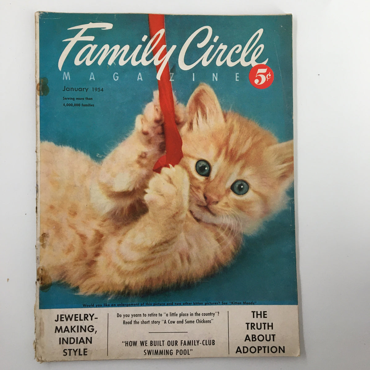 Cover of the VTG Family Circle Magazine from January 1954 featuring a playful kitten and the title 'The Truth About Adoption'. Vintage charm with articles on family themes.
