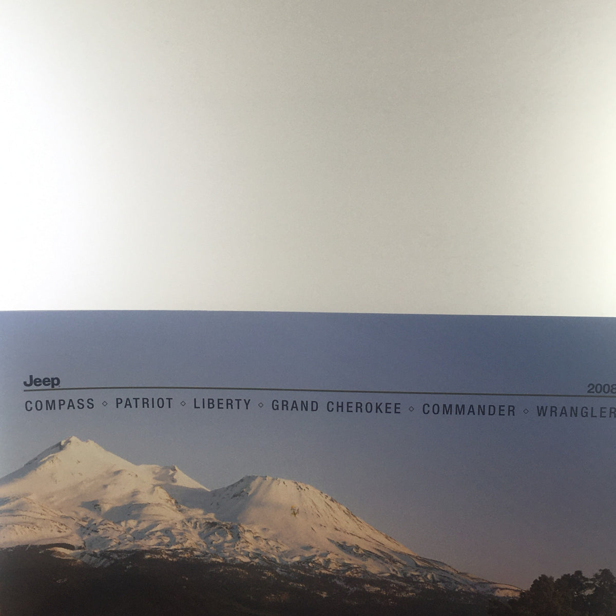 Top view of the front cover from the 2008 Jeep Compass Patriot Liberty Wrangler Dealership Car Auto Brochure Catalog showcasing the year and Jeep models.