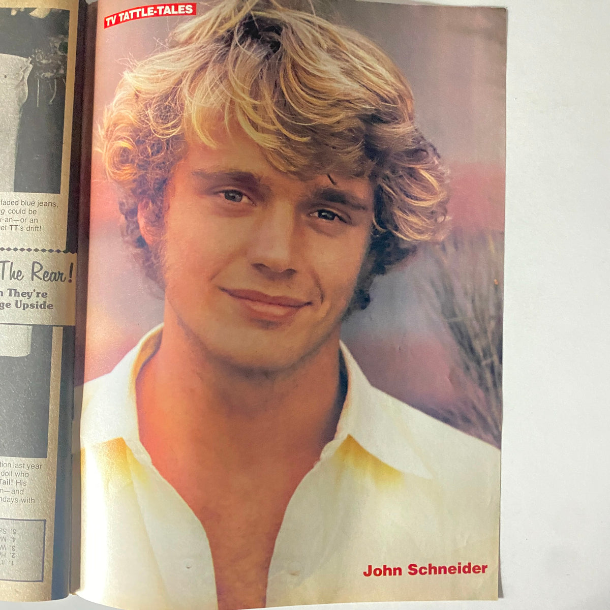 Photo of John Schneider included in 16 Magazine TV & Movie Tattle-Tales Fall 1982, showing off his charming smile.