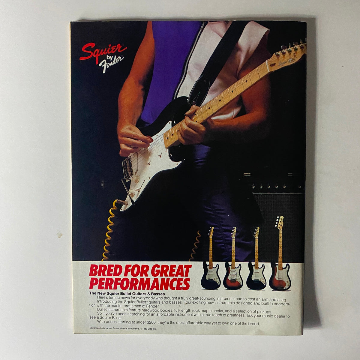 Ad for Squier by Fender in Hit Parader Magazine March 1984, promoting their instruments with a focus on performance and affordability for aspiring musicians.