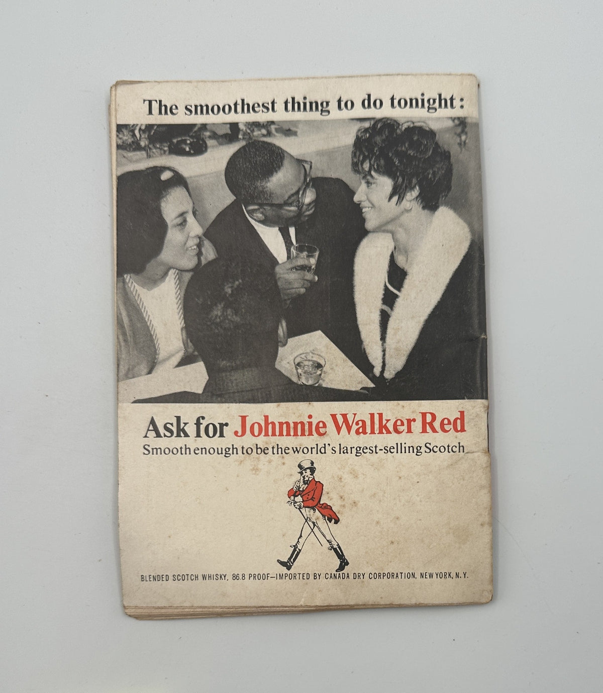 Advertisement from Jet Magazine March 3, 1966 promoting Johnnie Walker Red Scotch, showcasing a social gathering.