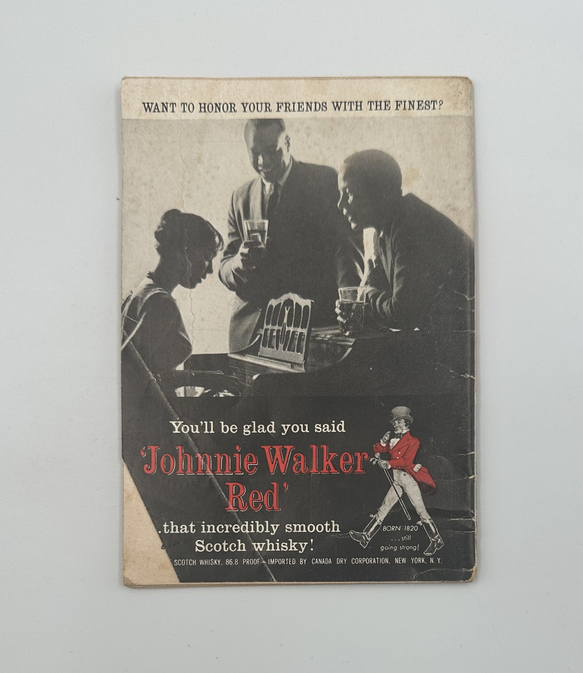 Back cover of Jet Magazine March 28, 1963, advertising Johnnie Walker Red Scotch whisky with an illustration of a man in a tuxedo serving drinks.