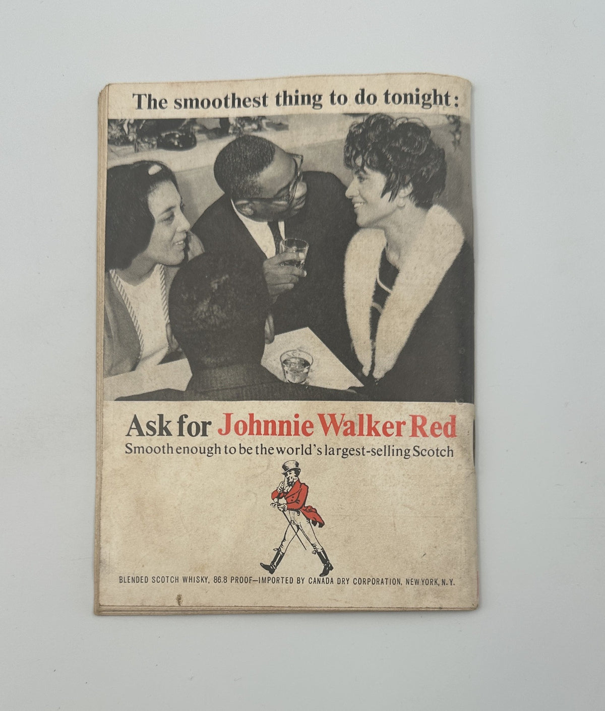 Advertisement page from Jet Magazine June 23, 1966, promoting Johnnie Walker Red Scotch whisky, showcasing a social gathering.