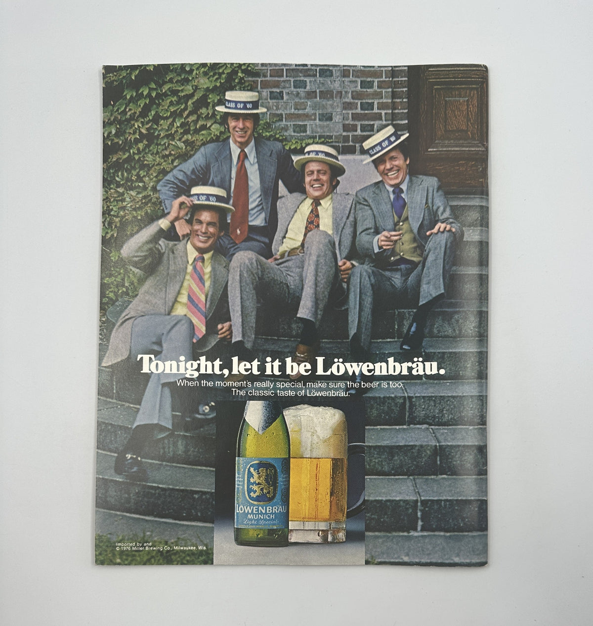 Vintage Löwenbräu advertisement from the 1970s featuring four men in suits enjoying the beer, captioned 'Tonight, let it be Löwenbräu.'