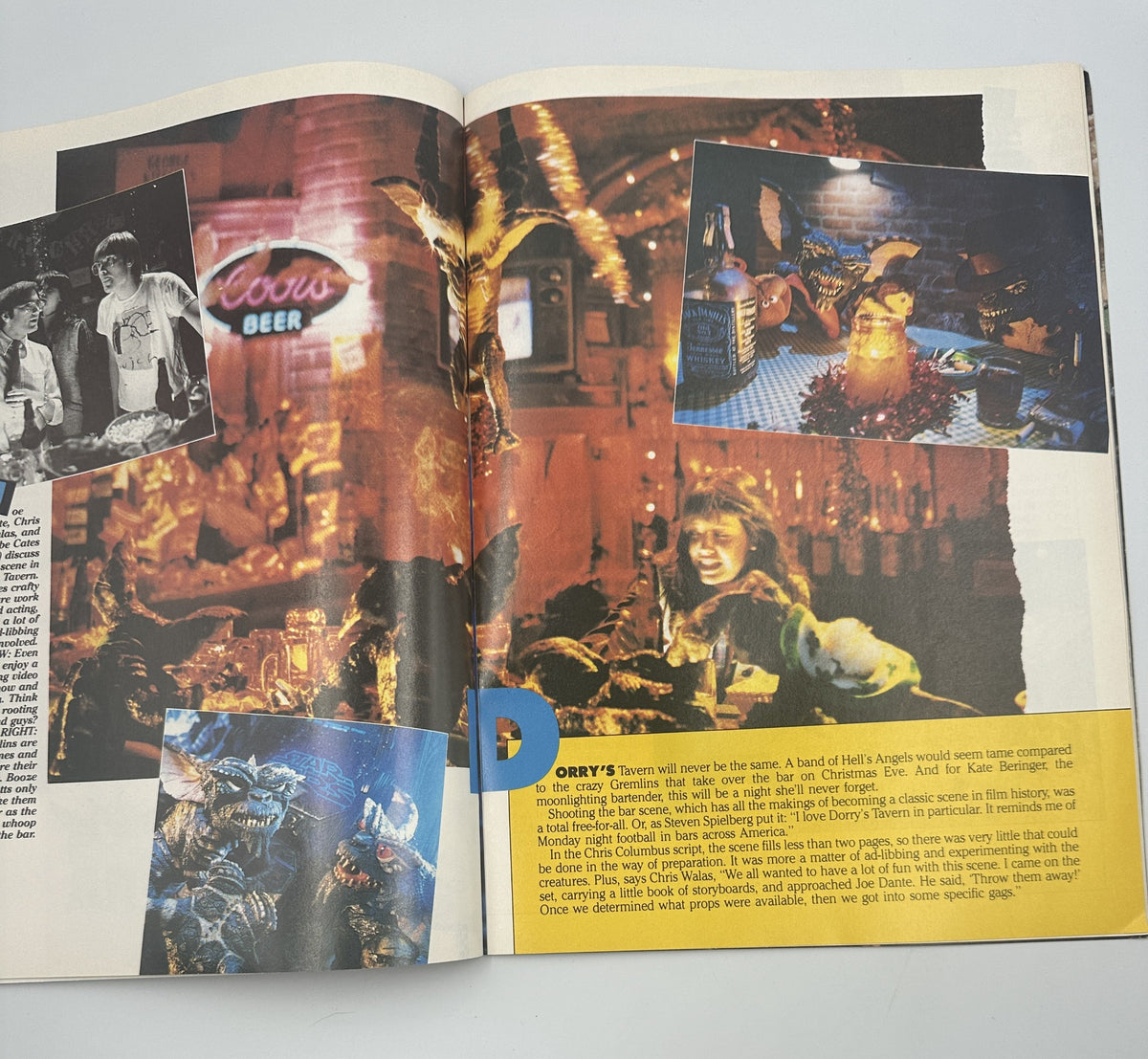 Inside spread of Gremlins Souvenir Magazine Official Collector’s Edition Steven Spielberg, showcasing a vibrant tavern scene with characters and Gremlins immersed in festive activities.