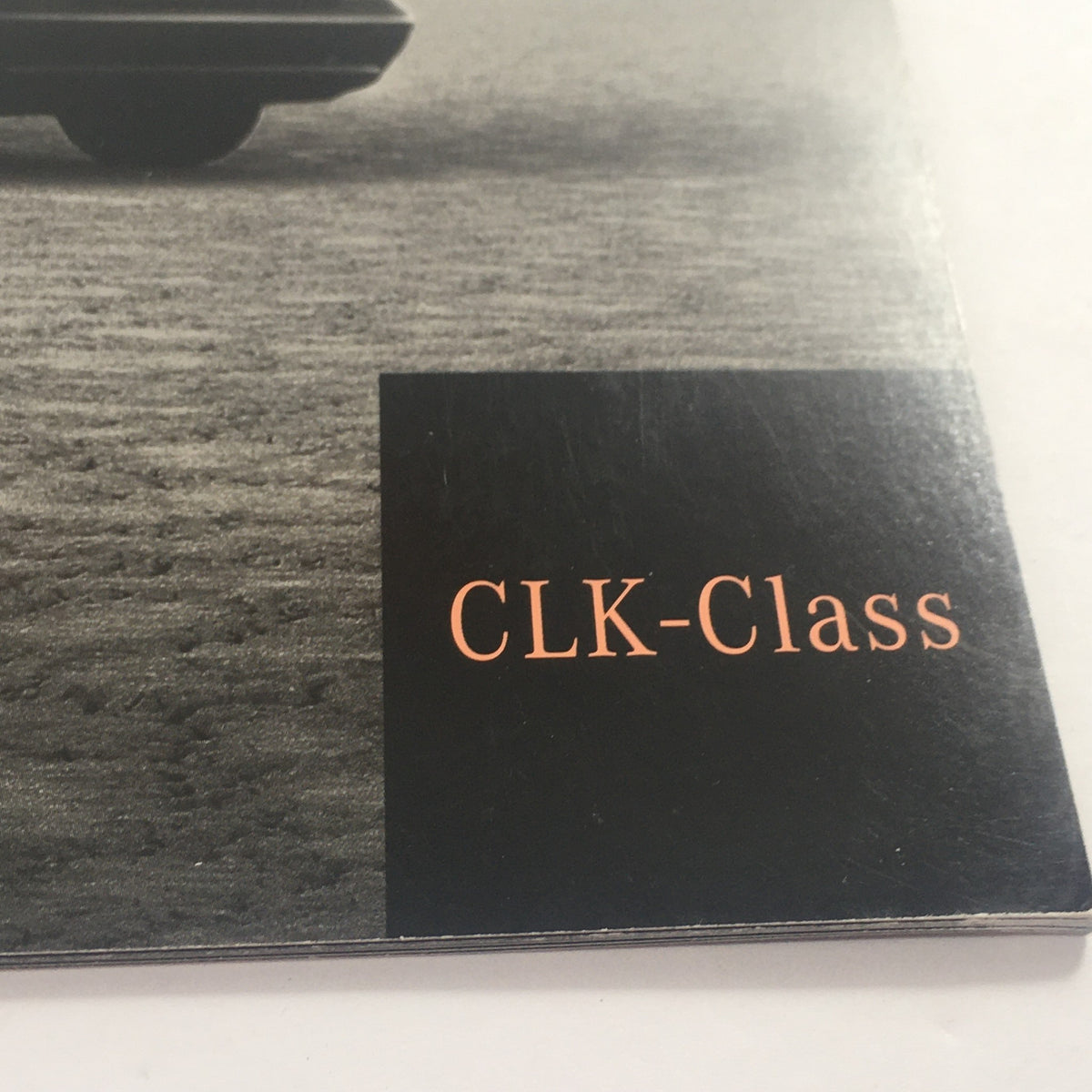 Close-up of the 2000 Mercedes-Benz CLK-Class dealership car auto brochure catalog highlighting the CLK-Class logo.