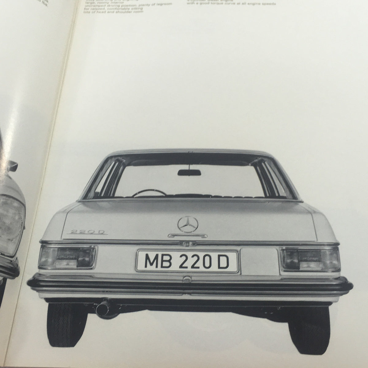 Rear view of the 1960s Mercedes-Benz 220-D showcasing its design in the auto brochure catalog.