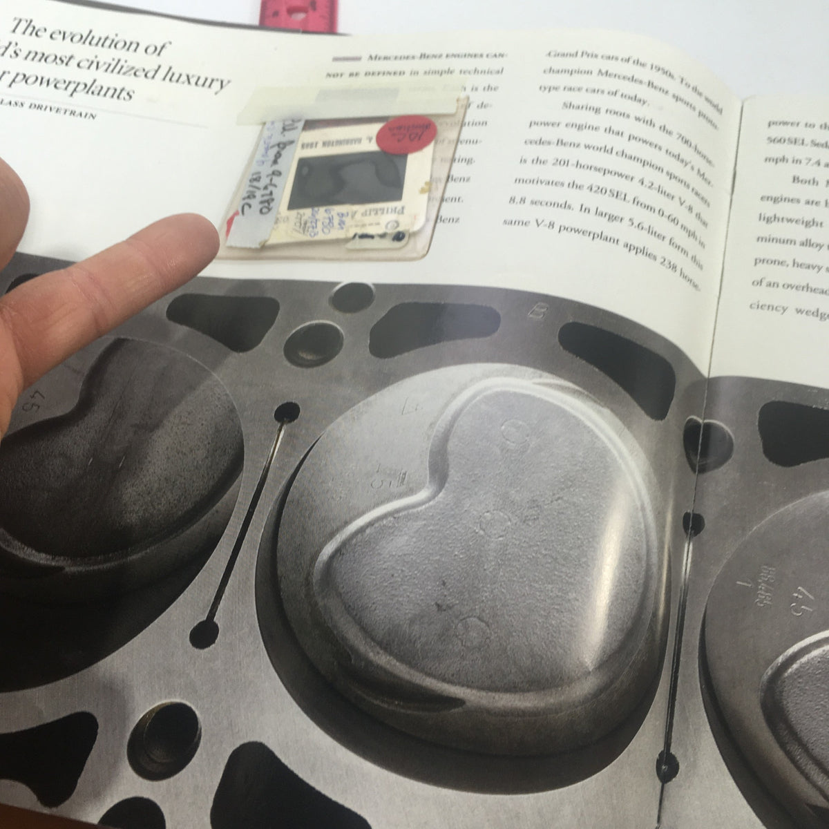 Detailed view of the engine diagram in the 1991 Mercedes-Benz S-Class 300 SE-Sedan Dealership Car Auto Brochure Catalog, highlighting design features with labels.