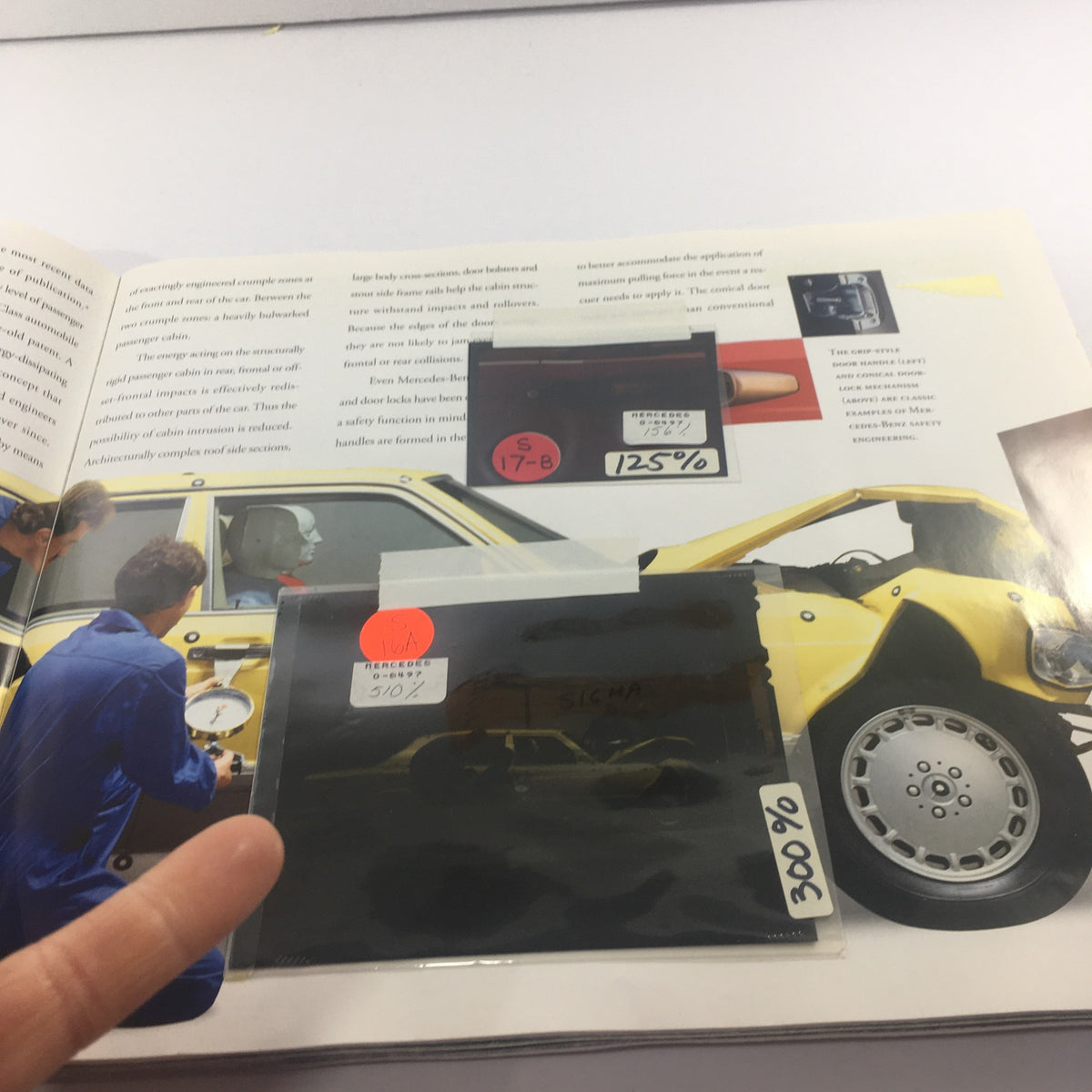 Image of the interior of the 1991 Mercedes-Benz S-Class 300 SE-Sedan Dealership Car Auto Brochure Catalog featuring a technician engaged in safety testing.