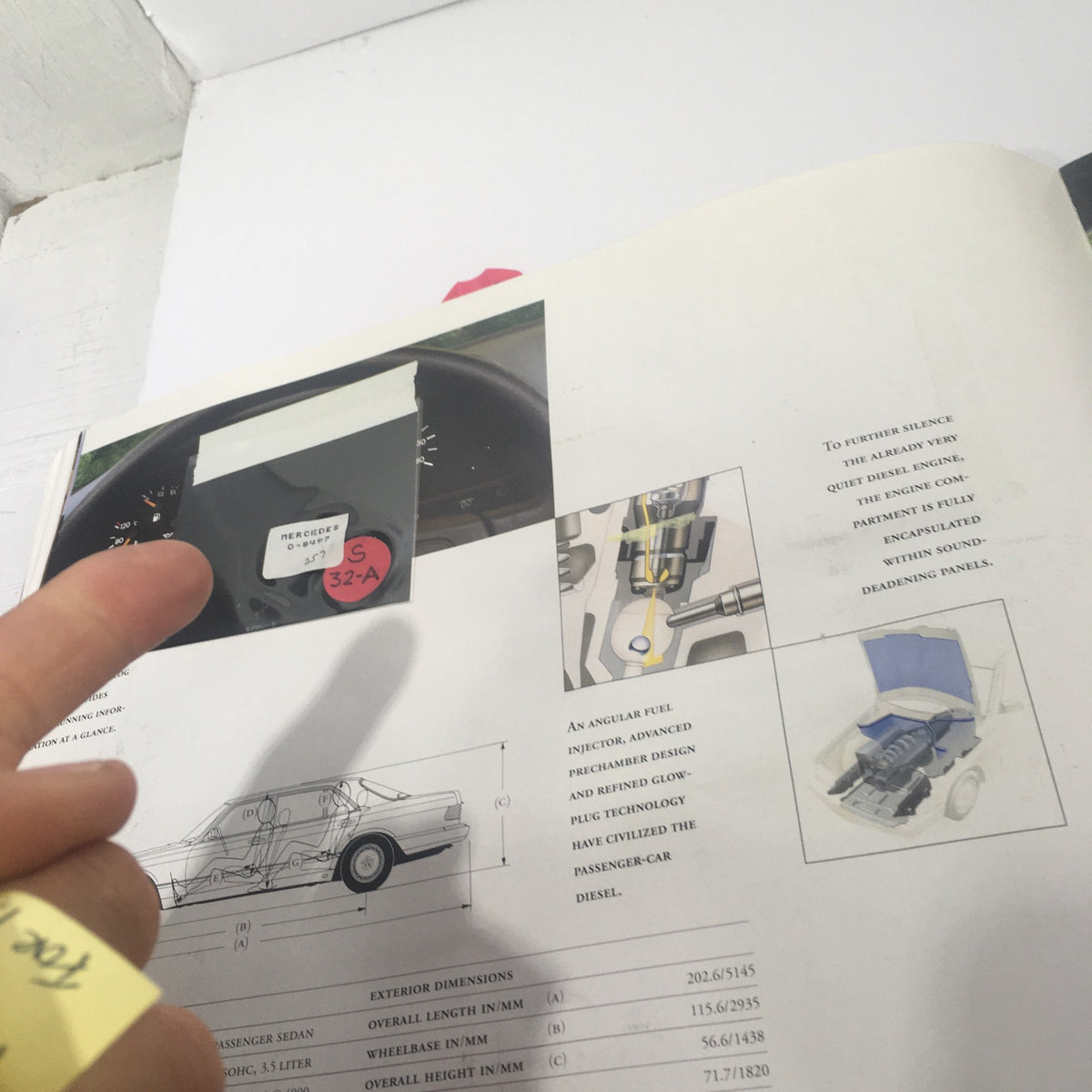 Close-up of the 1991 Mercedes-Benz S-Class 300 SE-Sedan Dealership Car Auto Brochure Catalog page showing vehicle dashboard and technical illustrations.