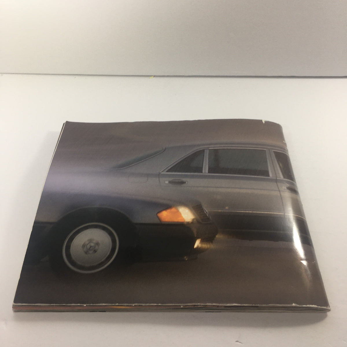 Side view of the 1991 Mercedes-Benz S-Class 300 SE-Sedan Dealership Car Auto Brochure Catalog highlighting the vehicle's sleek design.