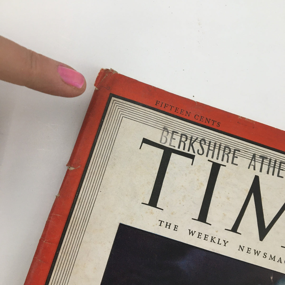A close-up view of the top corner of Time Magazine July 12, 1943, showcasing its vintage design and minor wear.