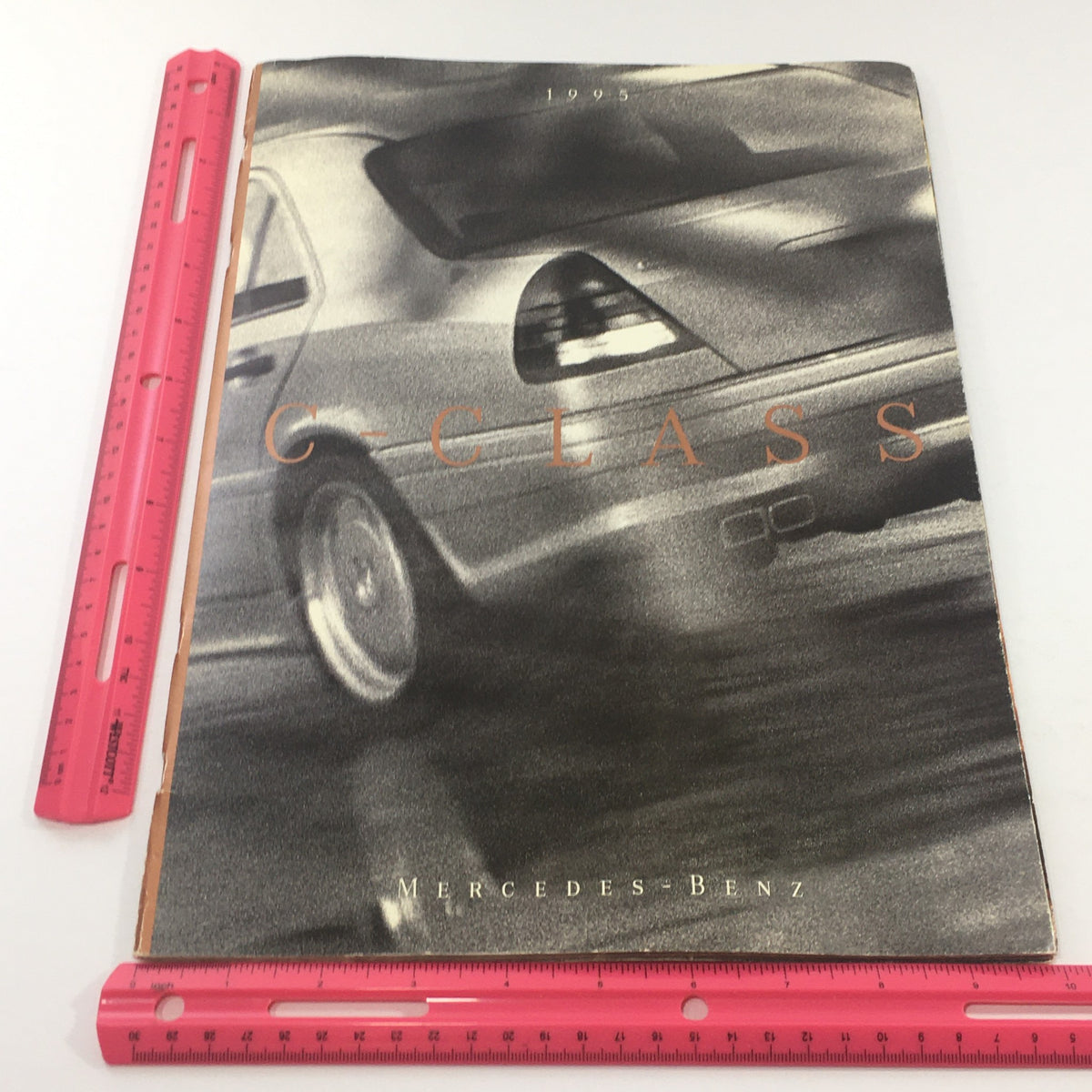 Front cover of the 1995 Mercedes-Benz C-Class C-36 Sedan Dealership Car Auto Brochure Catalog, featuring a dynamic image of the C-Class and its title.
