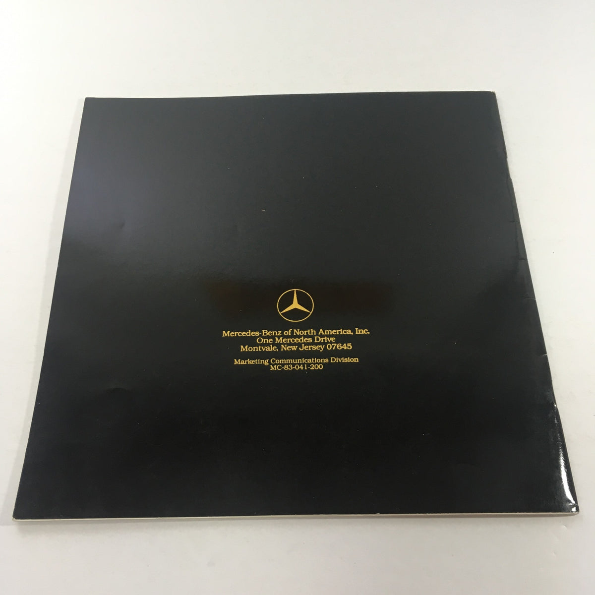 Back cover of the 1984 Mercedes-Benz 190E 2.3/190D 2.2 Dealership Car Auto Brochure with branding and contact details.