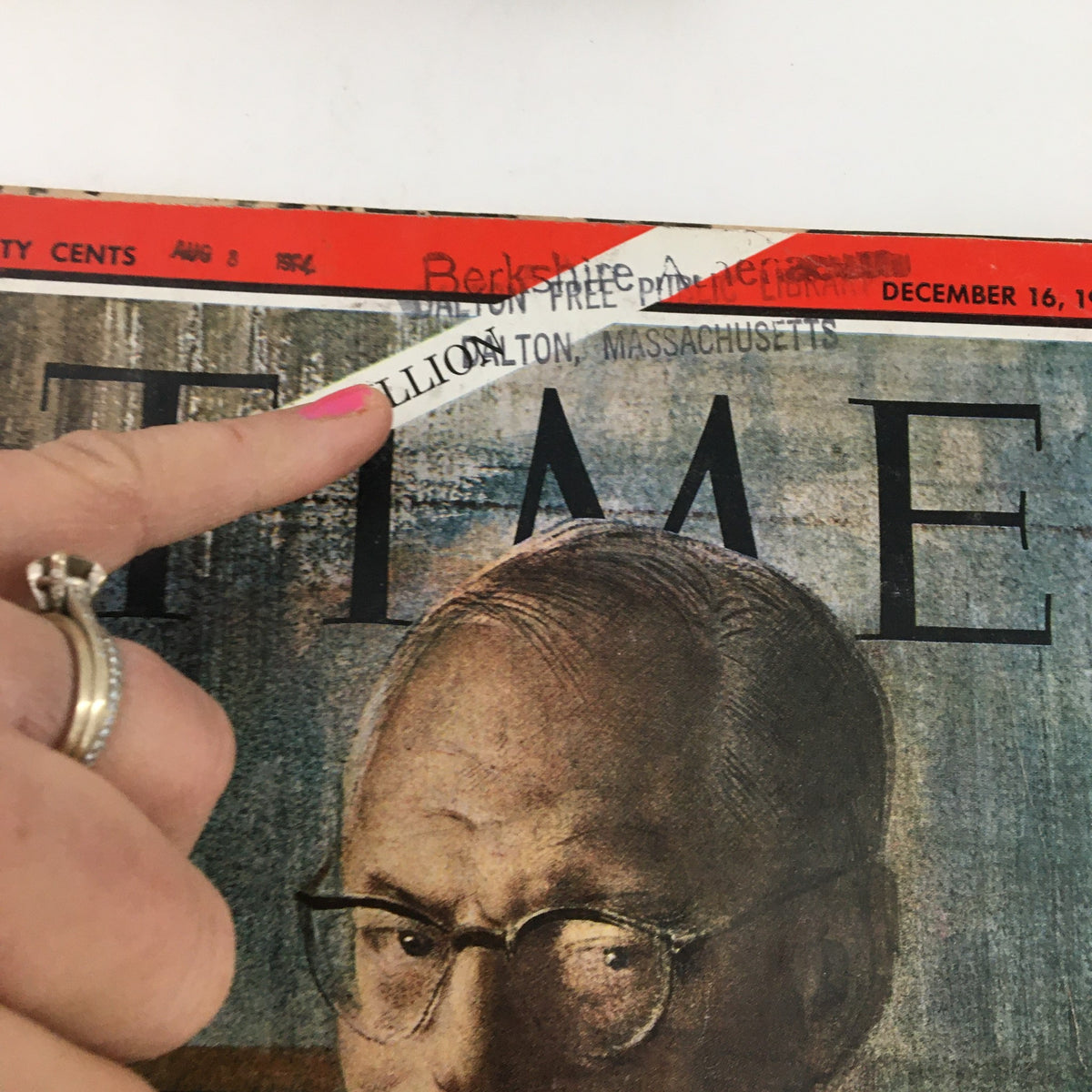 Close-up view of Time Magazine dated December 16, 1966, Volume 88, Number 25, highlighting an address label on the cover, showcasing its vintage appeal with finger pointing at the title and date.