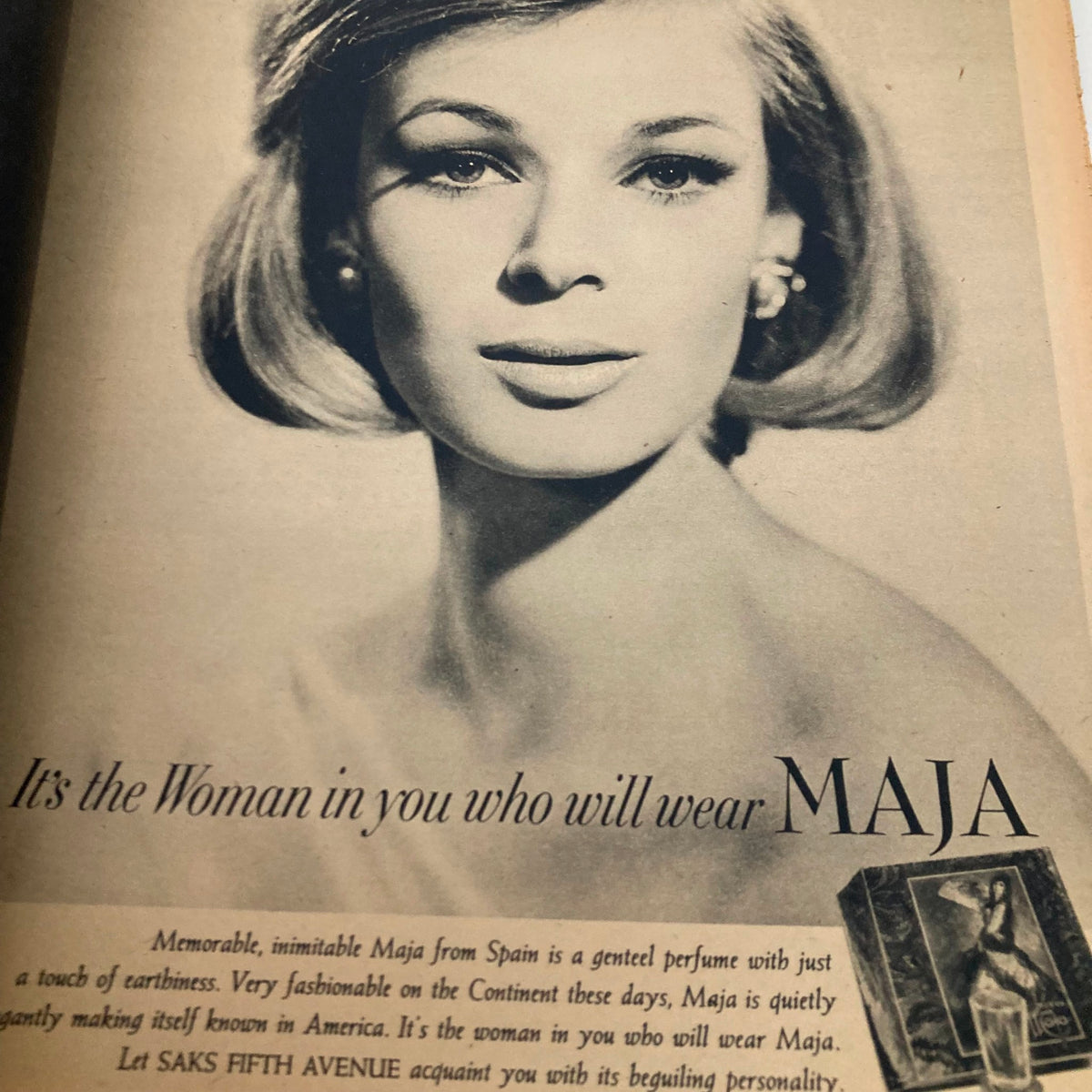 Classical advertisement in The New York Times Magazine November 24 1963 showcasing a glamorous woman promoting the Maja perfume, highlighting elegance.