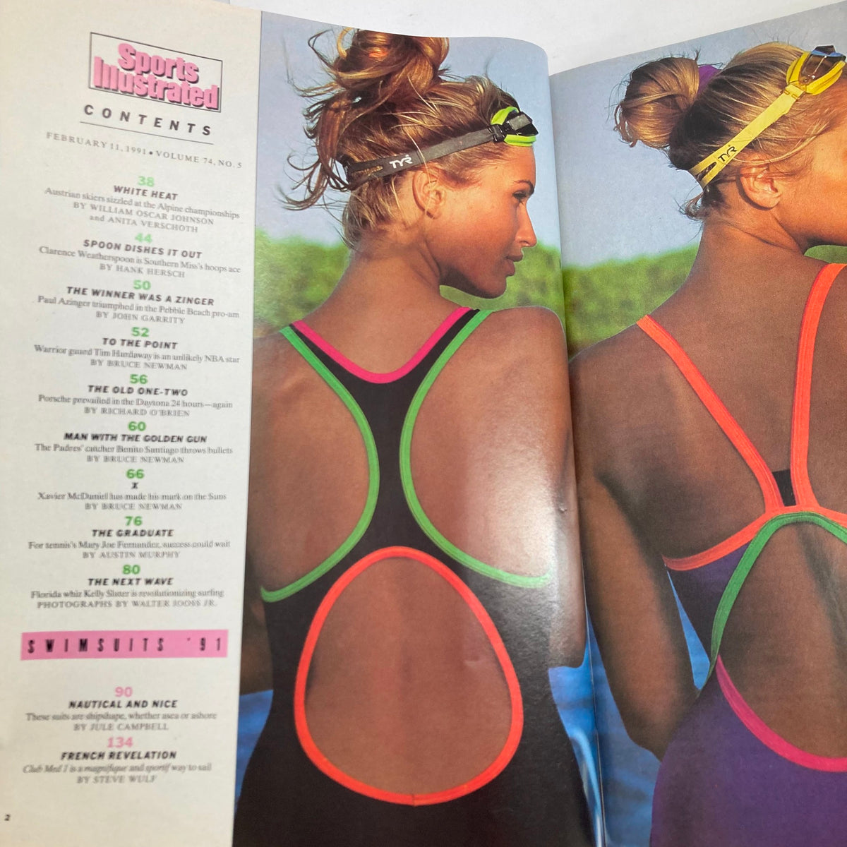 Contents page of Sports Illustrated Magazine February 11 1991 showcasing two female swimmers in stylish swimsuits, highlighting articles including Swimsuits '91.