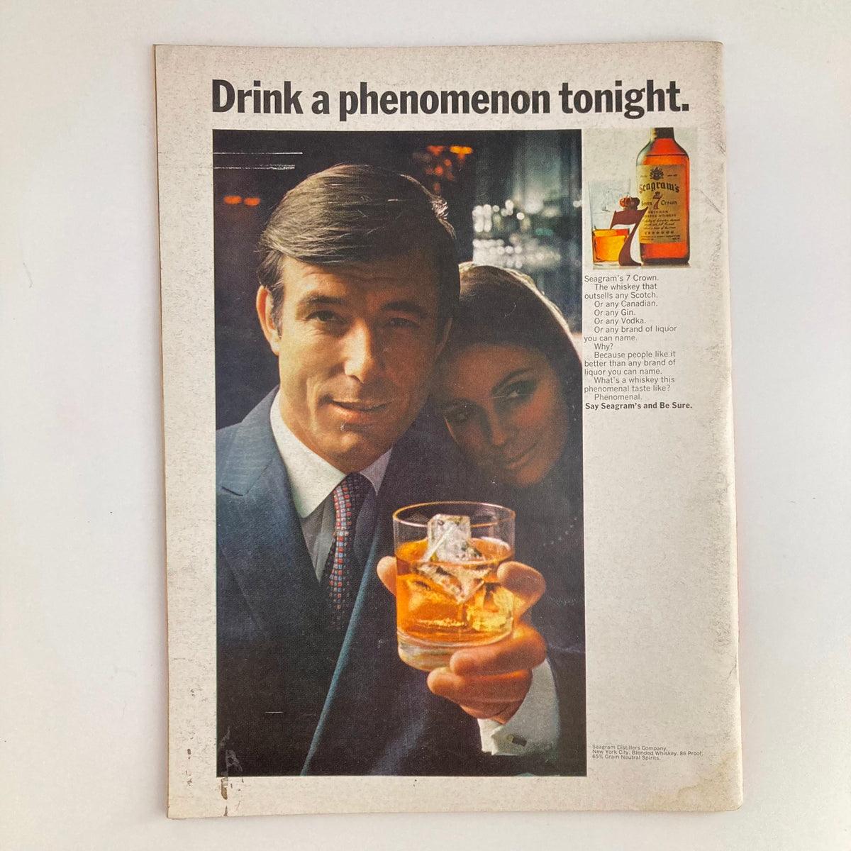 Advertisement page from Newsweek Magazine, showcasing a Seagram's 7 Crown whiskey ad, emphasizing its appeal and popularity.