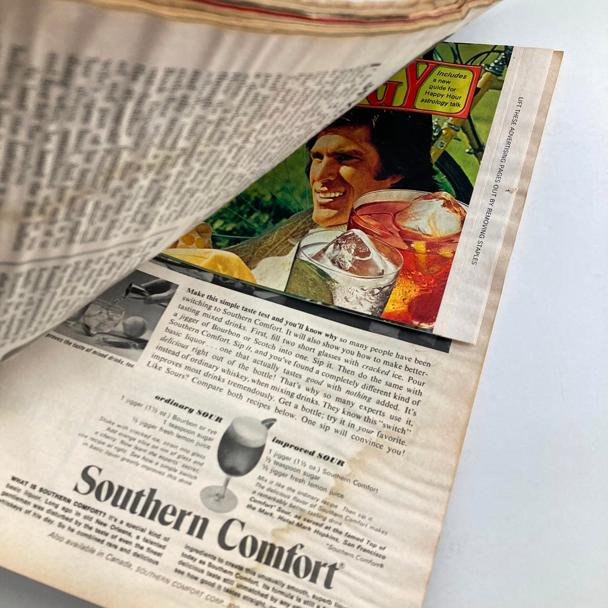 A page from the VTG Newsweek Magazine November 19, 1973, titled 'Running Out of Everything,' featuring an advertisement for Southern Comfort cocktails, capturing the cultural elements of the era.