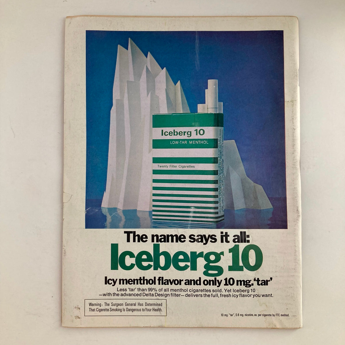 Vintage advertisement for Iceberg 10 cigarettes showcased in VTG Newsweek Magazine from March 19, 1973, highlighting menthol flavor and low-tar features.