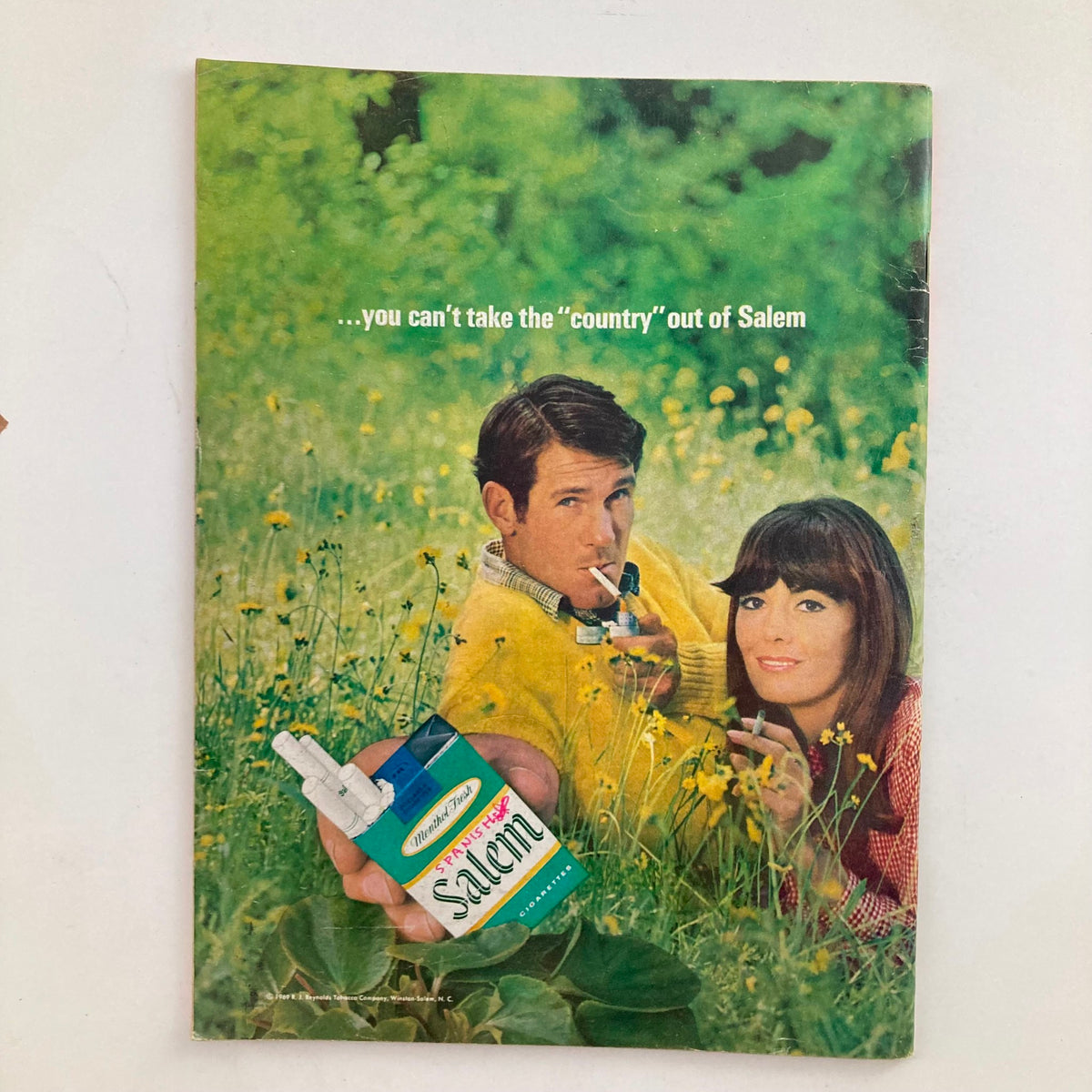 Vintage advertisement from May 1969 presenting a couple in a field, promoting Salem cigarettes with the slogan 'you can't take the ''country'' out of Salem'.