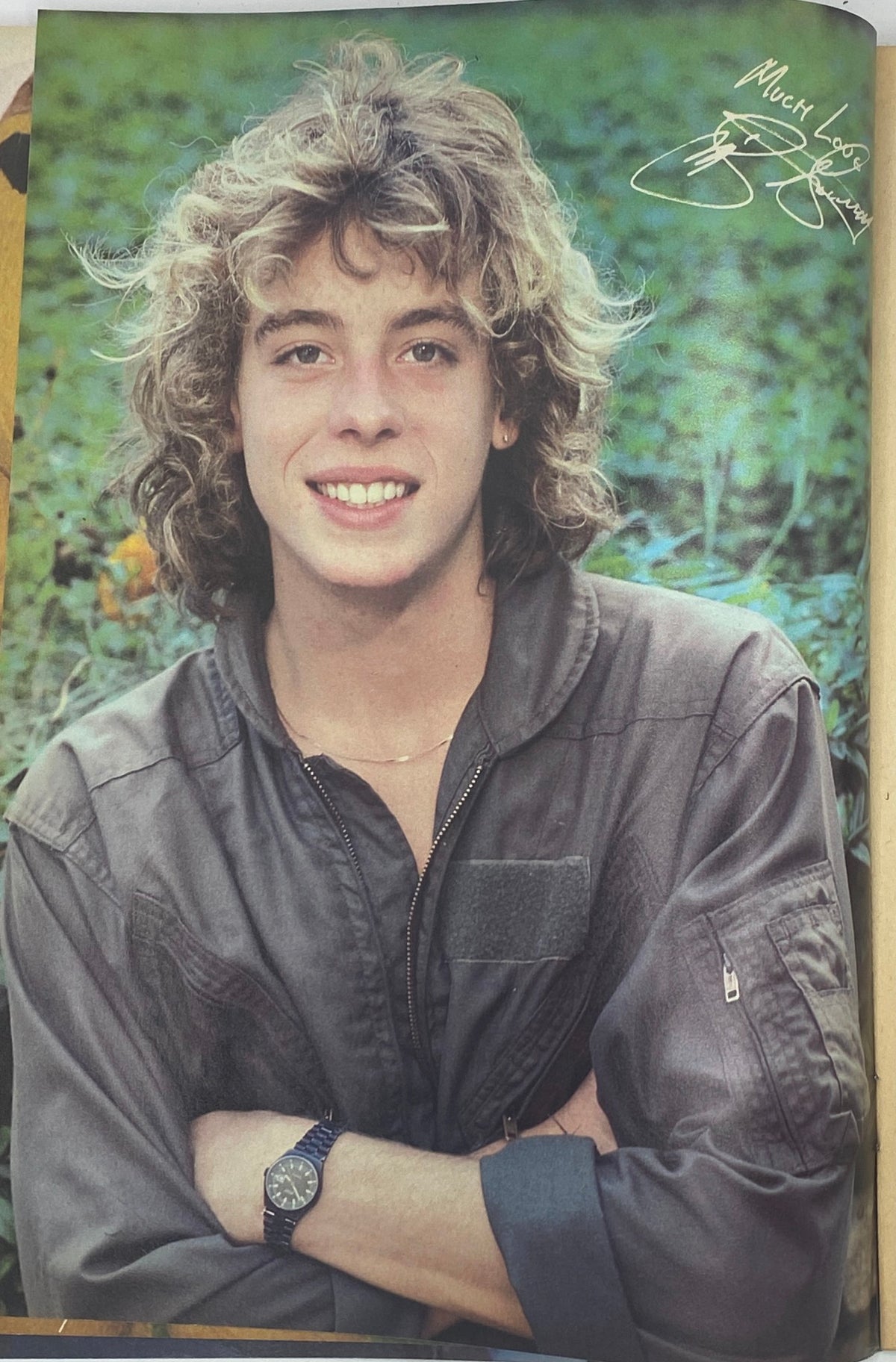 Vintage photograph of a young male model with curly blond hair, smiling while wearing a dark jacket, featured in SuperTeen Magazine November 1980, showcasing teen culture and youthful style.