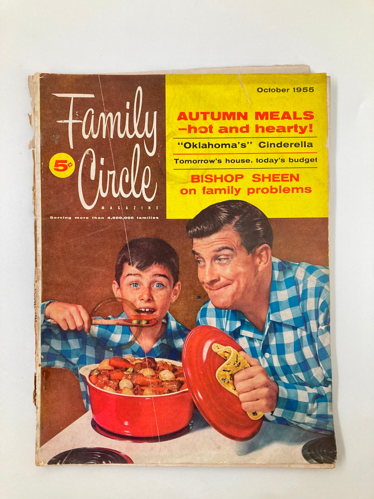 Cover of VTG Family Circle Magazine October 1955 featuring the article 'The Tightwad Millionaire' with a boy and man in matching blue checkered shirts enjoying a hearty meal.
