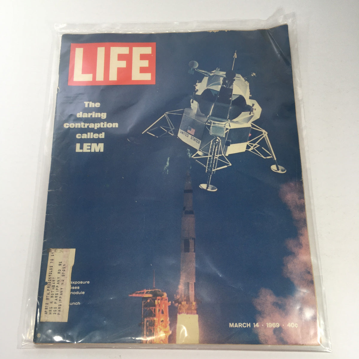 Vintage Life Magazine from March 14, 1969, featuring the cover story 'The Daring Contraption Called LEM', showcasing the Lunar Excursion Module (LEM) against a backdrop of a launching rocket.
