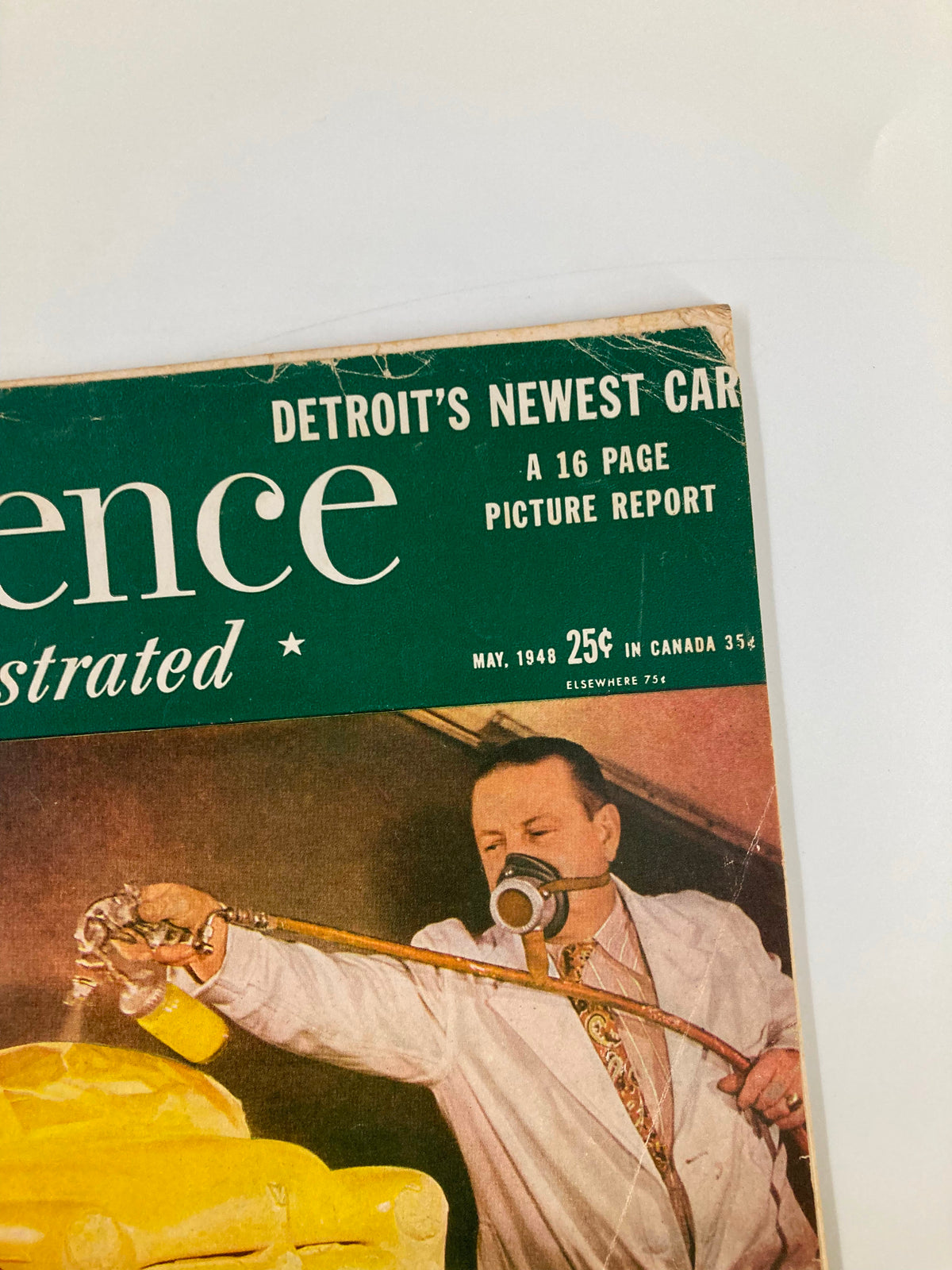Top portion of the VTG Science Illustrated Magazine May 1948 cover, emphasizing Detroit's Newest Car Picture Report, featuring a man with a spray gun painting a yellow car.