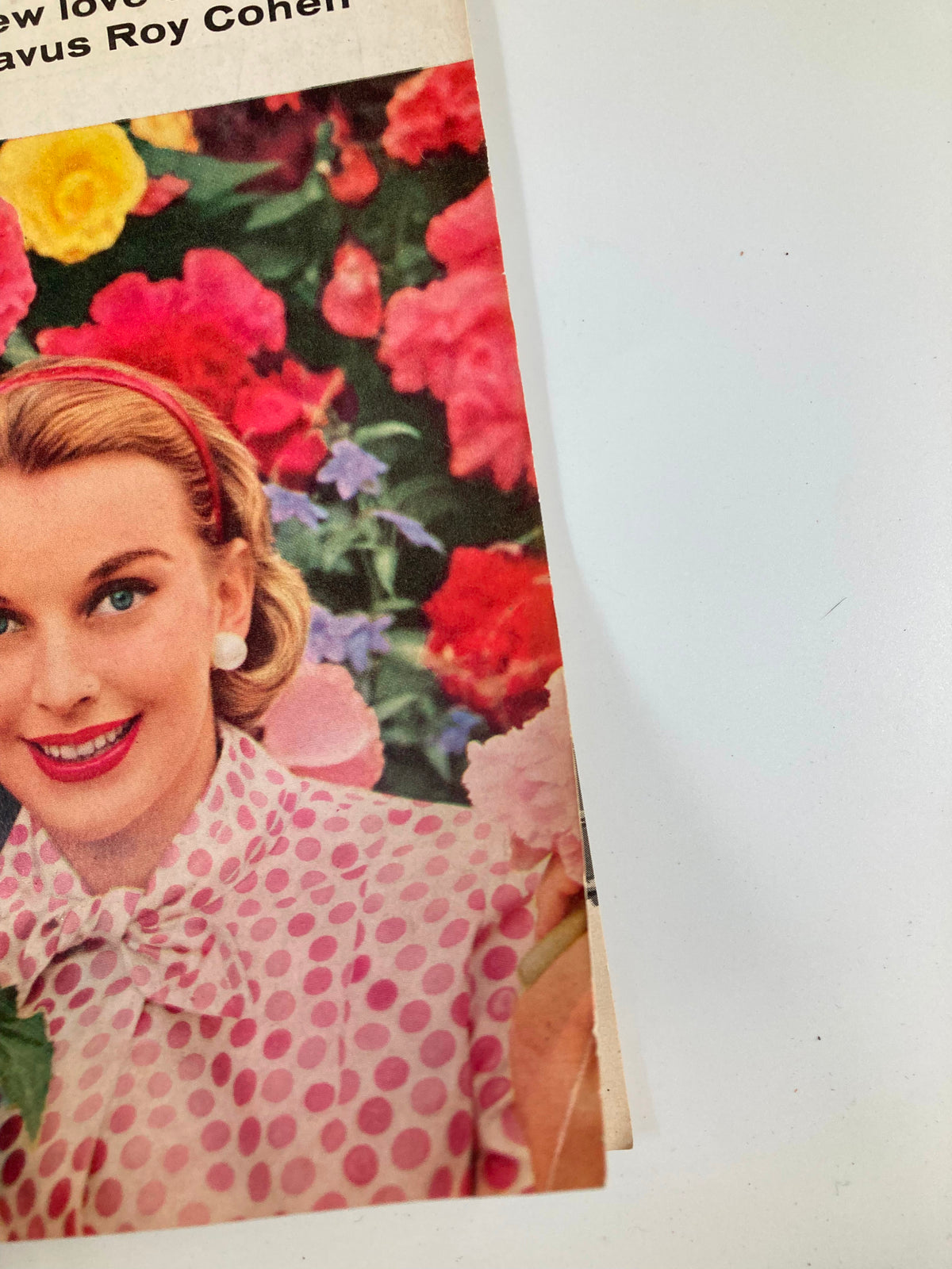 Close-up of the VTG Family Circle Magazine January 1956 cover highlighting the woman's joyful expression among colorful flowers.